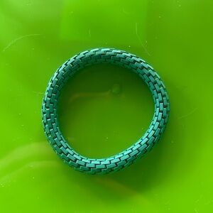 Teal stretchy metal bracelet.